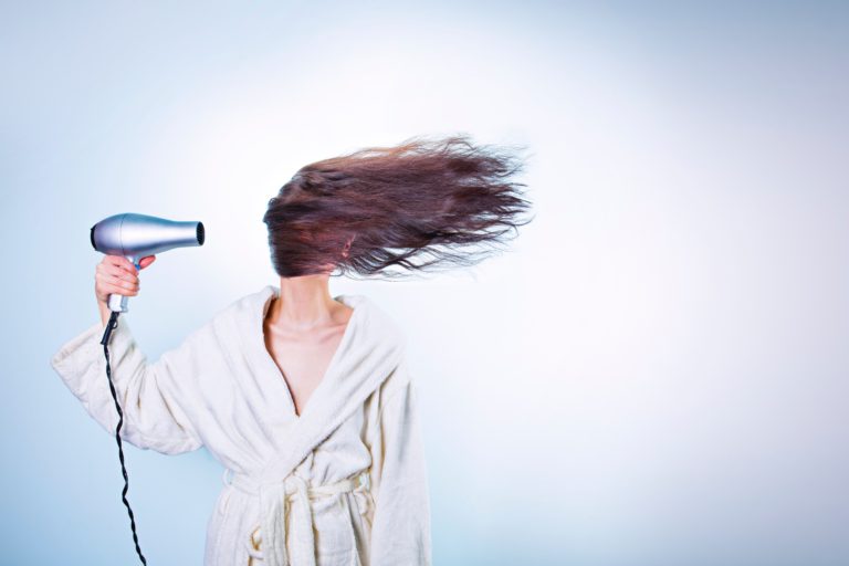 blow-drying hair